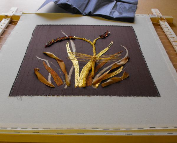 Embroidery finished, framing being discussed
